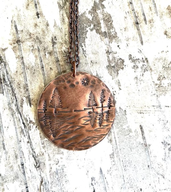 Copper reflecting trees scene necklace