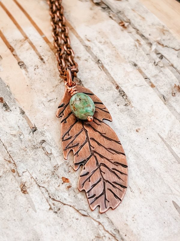 copper and turquoise feather necklace closeup